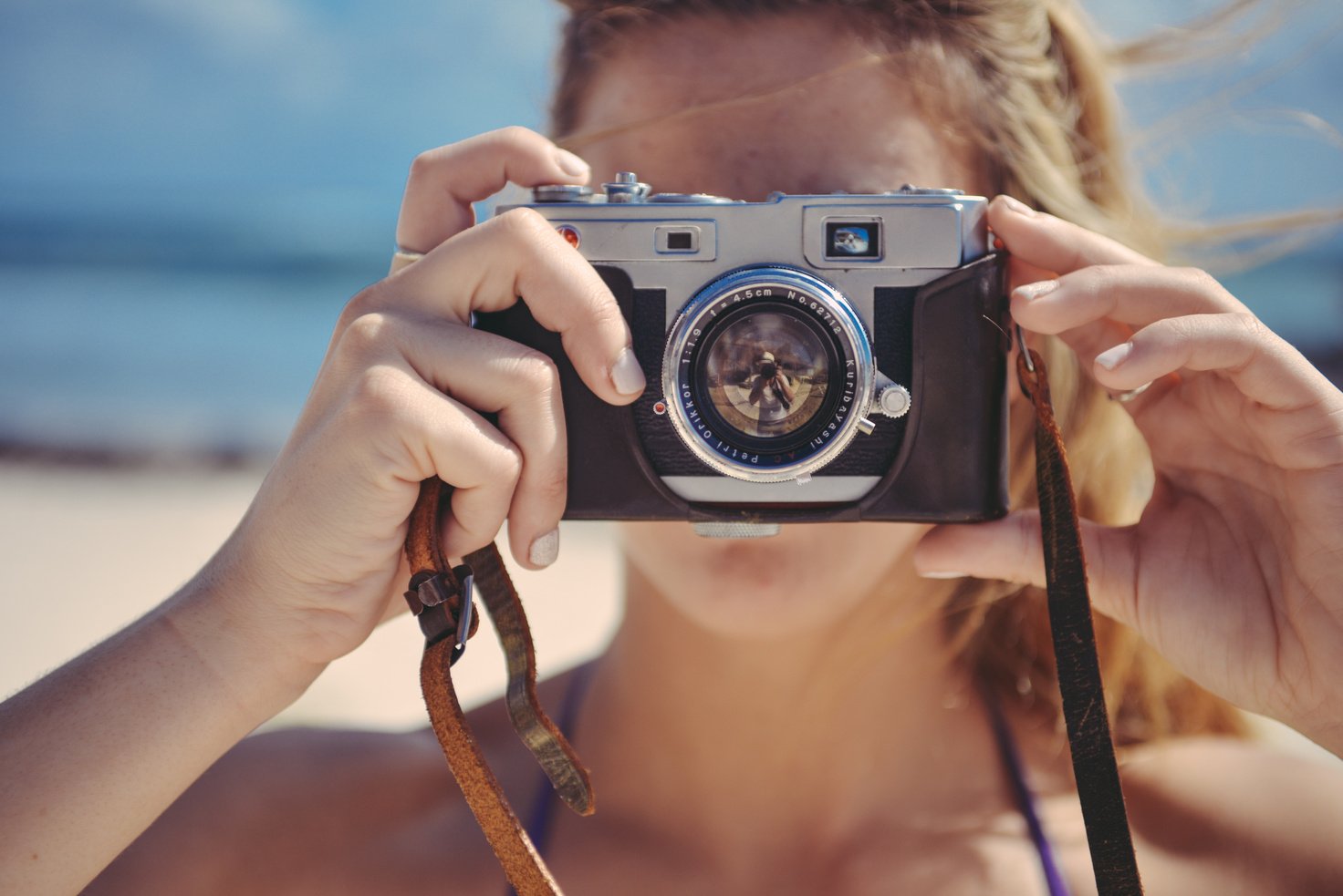 Woman Using Gray and Black Dslr Camera