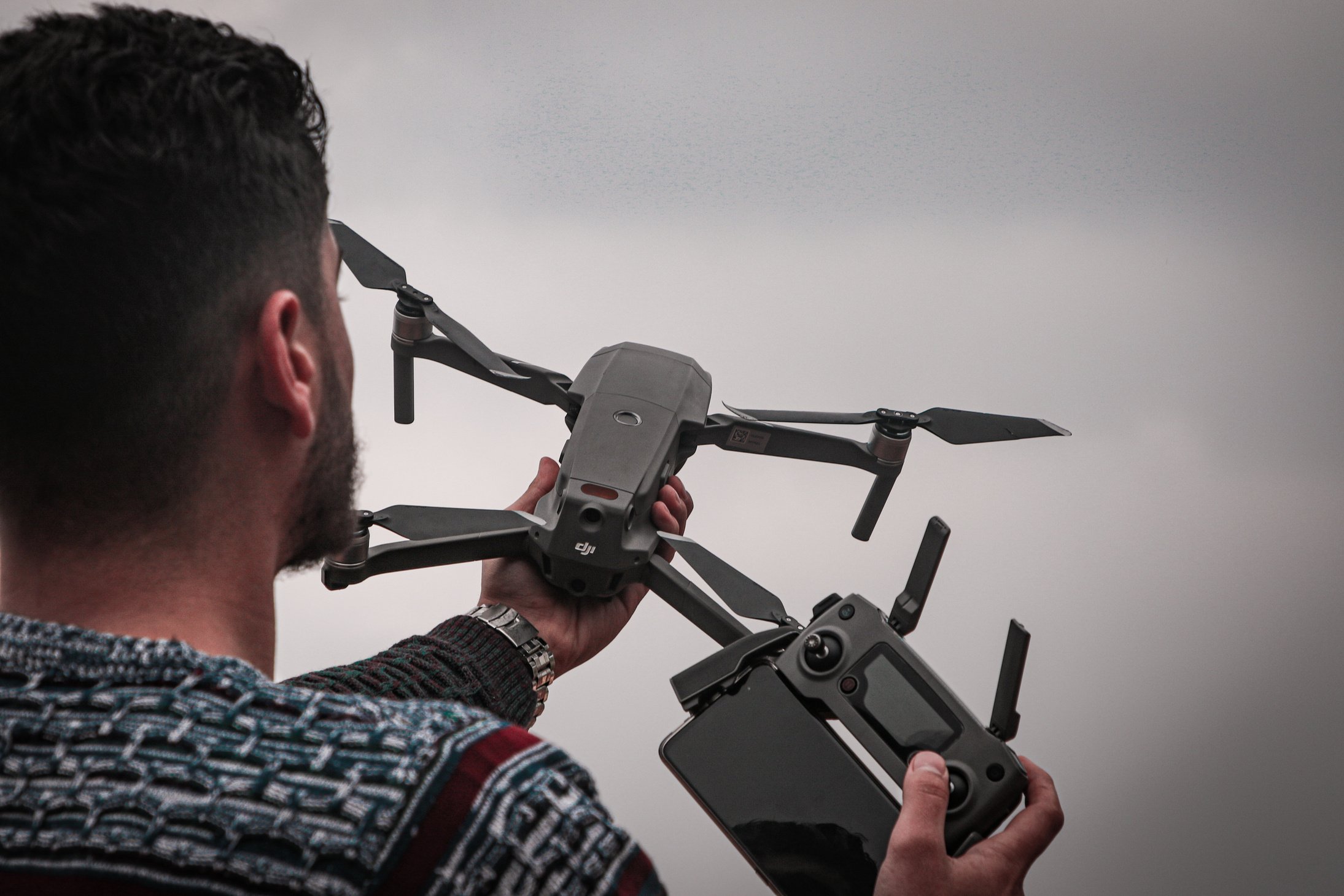 Man Holding Black Drone